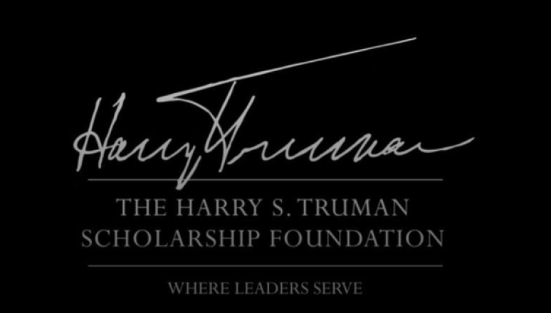 White script and text reading “Harry S. Truman The Harry S. Truman Scholarship Foundation Where Leaders Serve” on a black background.