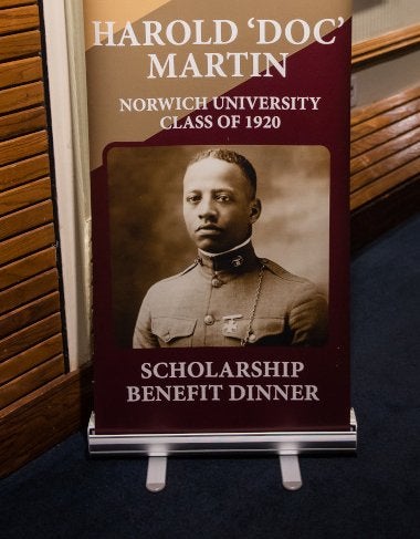 Event sign: Harold "Doc" Martin '20 Scholarship Benefit Dinner. Official Norwich senior photo of Harold "Doc" Martin '20.